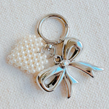 Load image into Gallery viewer, Knitted Pearl Heart Silver Bow Bag Charm
