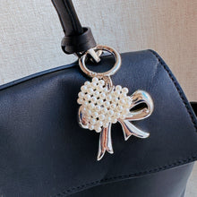 Load image into Gallery viewer, Knitted Pearl Heart Silver Bow Bag Charm
